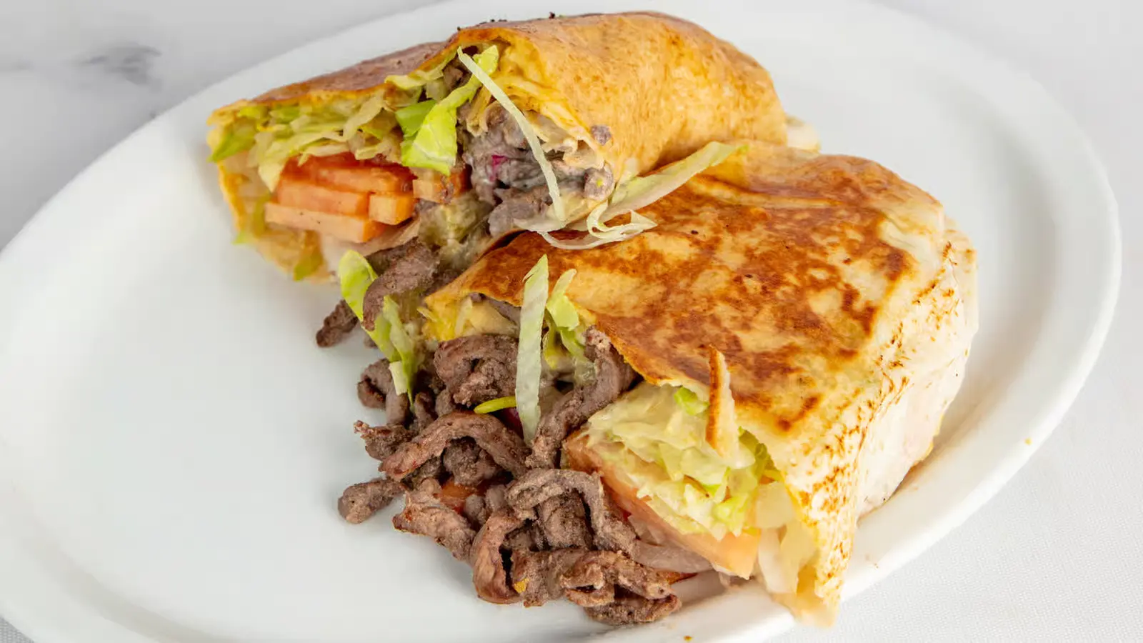 Royal Kabab Plate with beef chicken and lamb kababs at Syrian restaurant Edmonton