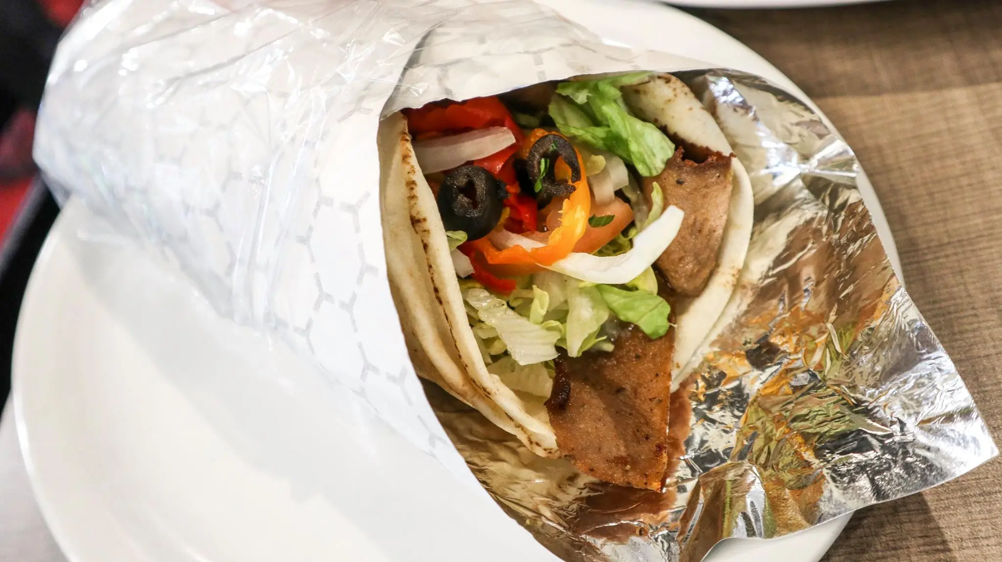 Jumbo Beef Donair with fresh vegetables and garlic sauce at Donair & Shawarma House West Edmonton